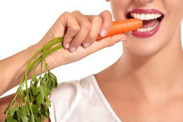Girl eats raw carrots