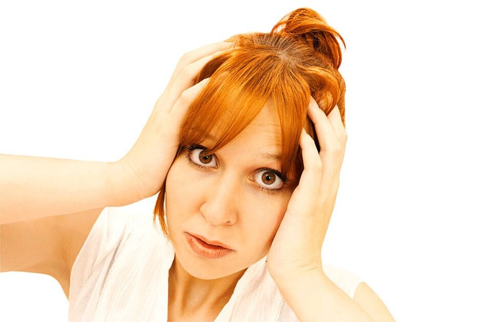 A woman holds the head
